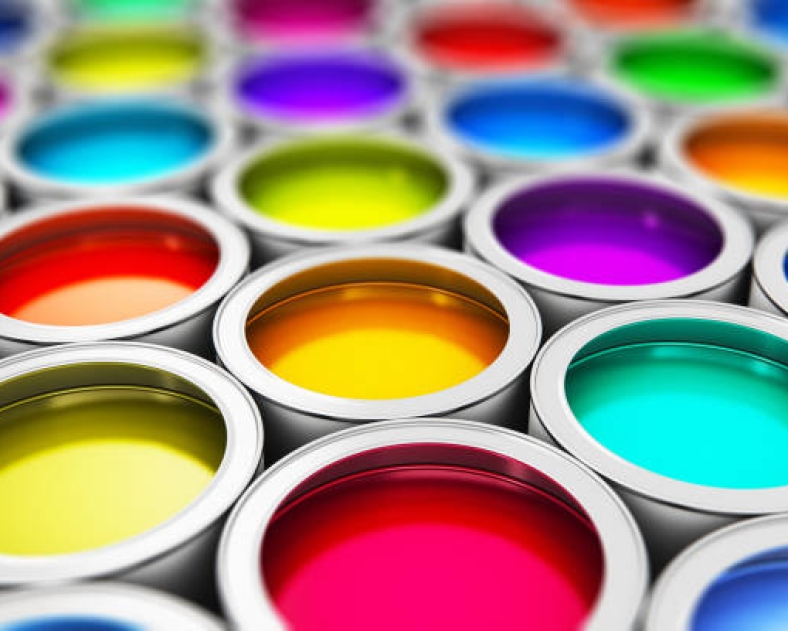 Abstract creativity concept: group of tin metal cans with color paint dye